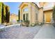 Inviting patio with white metal furniture and brick pavers at 7943 Harbour Towne Ave, Las Vegas, NV 89113