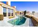 Stunning pool and patio area with adjacent house at 7943 Harbour Towne Ave, Las Vegas, NV 89113