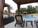 Relaxing pool-side lounge area with private cabanas and comfortable chaise lounges at 7943 Harbour Towne Ave, Las Vegas, NV 89113