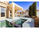 Relaxing backyard oasis with a sparkling pool, spa, and covered patio at 7943 Harbour Towne Ave, Las Vegas, NV 89113
