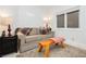 Charming sitting area with a sofa and wooden bench at 7943 Harbour Towne Ave, Las Vegas, NV 89113