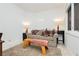Cozy sitting room featuring a sofa, end tables, and lamps at 7943 Harbour Towne Ave, Las Vegas, NV 89113