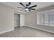 Bright bedroom with a ceiling fan and walk-in closet at 8232 Ocean Terrace Way, Las Vegas, NV 89128