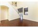 Two-story living room with hardwood floors and staircase at 824 Clear Diamond Ave, Las Vegas, NV 89123