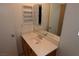 Bathroom vanity featuring a sink, mirror, and medicine cabinet for functional storage and grooming at 10264 Headrick Dr, Las Vegas, NV 89166