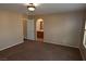 Primary bedroom with brown carpet and ensuite bathroom access at 10264 Headrick Dr, Las Vegas, NV 89166