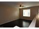 This bedroom features dark wood floors, neutral walls and a ceiling fan at 10264 Headrick Dr, Las Vegas, NV 89166