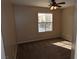 Bright bedroom with carpet flooring and ceiling fan at 10264 Headrick Dr, Las Vegas, NV 89166