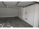 Spacious garage with painted walls and concrete floor at 10264 Headrick Dr, Las Vegas, NV 89166