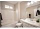 Clean bathroom with bathtub, shower, and modern vanity at 10823 Crestview Pointe Ave, Las Vegas, NV 89166