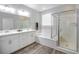 Elegant bathroom with double vanity and soaking tub at 10823 Crestview Pointe Ave, Las Vegas, NV 89166