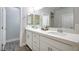 Double vanity bathroom with white cabinets and a mirror at 10823 Crestview Pointe Ave, Las Vegas, NV 89166