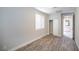 Bedroom with wood-look flooring and access to patio at 10823 Crestview Pointe Ave, Las Vegas, NV 89166