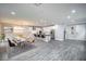 Open concept dining area with modern light fixture and seating for six at 10823 Crestview Pointe Ave, Las Vegas, NV 89166