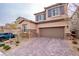 Two story house with attached garage and landscaped front yard at 10823 Crestview Pointe Ave, Las Vegas, NV 89166