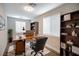 Home office with built-in shelving and hardwood floors at 10823 Crestview Pointe Ave, Las Vegas, NV 89166