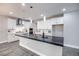 Modern kitchen with white cabinets, stainless steel appliances, and a large island at 10823 Crestview Pointe Ave, Las Vegas, NV 89166