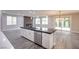 Modern kitchen island with white cabinets and dark countertop at 10823 Crestview Pointe Ave, Las Vegas, NV 89166