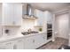 Modern kitchen with white cabinets, stainless steel appliances, and a gas cooktop at 10823 Crestview Pointe Ave, Las Vegas, NV 89166