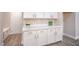 White cabinets and countertop in laundry room at 10823 Crestview Pointe Ave, Las Vegas, NV 89166