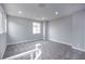 Bright loft bedroom featuring grey carpeting and large window at 10823 Crestview Pointe Ave, Las Vegas, NV 89166