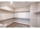 Spacious walk-in closet with ample shelving and hanging space at 10823 Crestview Pointe Ave, Las Vegas, NV 89166