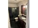 Clean bathroom with dark vanity and a glass shower at 1405 Vegas Valley Dr # 398, Las Vegas, NV 89169