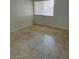 Bright bedroom with tile floors and a large window at 1405 Vegas Valley Dr # 398, Las Vegas, NV 89169