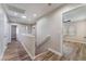 Upstairs hallway with neutral walls and wood-look flooring at 1512 Groom Ave, North Las Vegas, NV 89081