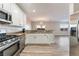 Modern kitchen features stainless steel appliances and white shaker cabinets at 1512 Groom Ave, North Las Vegas, NV 89081