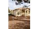 Rear view of house showing a patio and landscaping at 1900 N Torrey Pines Dr # 132, Las Vegas, NV 89108