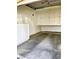 Garage with white cabinets and overhead storage at 1900 N Torrey Pines Dr # 132, Las Vegas, NV 89108