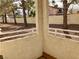 Private patio with treetop views and a small yard at 1900 N Torrey Pines Dr # 132, Las Vegas, NV 89108