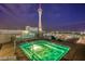 Hot tub on a rooftop deck with a city view at night at 200 W Sahara Ave # 2806, Las Vegas, NV 89102