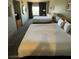 Spacious hotel bedroom with two double beds at 211 E Flamingo Rd # 1114, Las Vegas, NV 89121