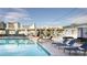 Rooftop pool with lounge chairs and city view at 211 E Flamingo Rd # 1114, Las Vegas, NV 89121