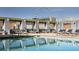 Rooftop pool with lounge chairs and city view at 211 E Flamingo Rd # 1114, Las Vegas, NV 89121