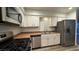 Updated kitchen featuring stainless steel appliances and granite countertops at 2136 Chertsey Dr # A, Las Vegas, NV 89108