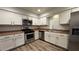 Bright kitchen with stainless steel appliances and light cabinets at 2136 Chertsey Dr # A, Las Vegas, NV 89108