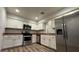 Modern kitchen with stainless steel appliances and wood-look floors at 2136 Chertsey Dr # A, Las Vegas, NV 89108