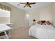 Well-lit bedroom with a comfortable bed and a built-in workspace at 2214 Brighton Point Ave, Henderson, NV 89044