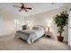 Serene bedroom with a queen-size bed and direct access to the bathroom at 2214 Brighton Point Ave, Henderson, NV 89044