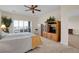 Spacious bedroom with built-in shelving, a ceiling fan, and plenty of natural light at 2214 Brighton Point Ave, Henderson, NV 89044