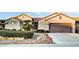 Single-story home with landscaped front yard and driveway at 2214 Brighton Point Ave, Henderson, NV 89044