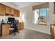 Bright home office features built-in cabinetry and a large window at 2214 Brighton Point Ave, Henderson, NV 89044