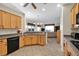 Open concept kitchen with island, stainless steel appliances and granite countertops at 2214 Brighton Point Ave, Henderson, NV 89044