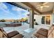 Covered patio overlooking the pool, spa, and scenic view at 2214 Brighton Point Ave, Henderson, NV 89044