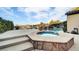 Octagonal spa and rectangular pool with surrounding deck at 2214 Brighton Point Ave, Henderson, NV 89044