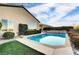 Inviting rectangular pool with stone coping, surrounded by landscaping at 2214 Brighton Point Ave, Henderson, NV 89044