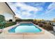 Relaxing rectangular pool with stone coping and water feature at 2214 Brighton Point Ave, Henderson, NV 89044